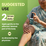 Person applying a bottle of cream to their arm with text on a green background