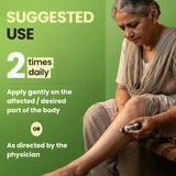 Woman applying a cream to her leg with text about suggested use on a green background