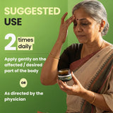 Woman holding a jar with text about suggested use on a green background