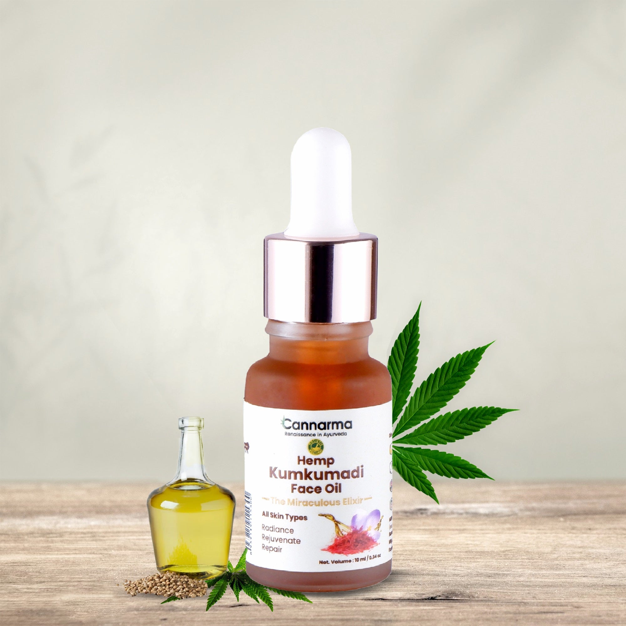 Cannarma Hemp Kumkumadi Face Oil for all skin types in a glass dropper bottle with hemp leaves